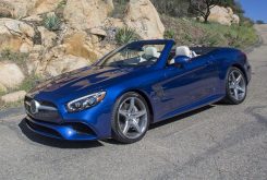 three quarter view of electric blue Mercedes SL-Class 2017 on mountain road