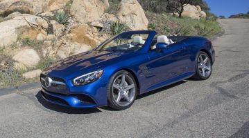 three quarter view of electric blue Mercedes SL-Class 2017 on mountain road